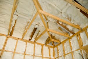 Newly sprayed insulation. A room at a newly constructed home is sprayed with liquid insulating foam before the drywall is added. Spray Foam Insulation DIY Mistakes - Sooner Foam Insulation