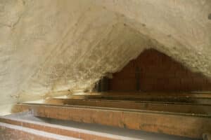 Spray foam coating insulation of home attic space. Spray foam for your attic - Sooner Foam Insulation.