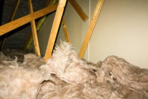 A view of attic insulation within a typical household. Mold in Insulation - Sooner Foam. 